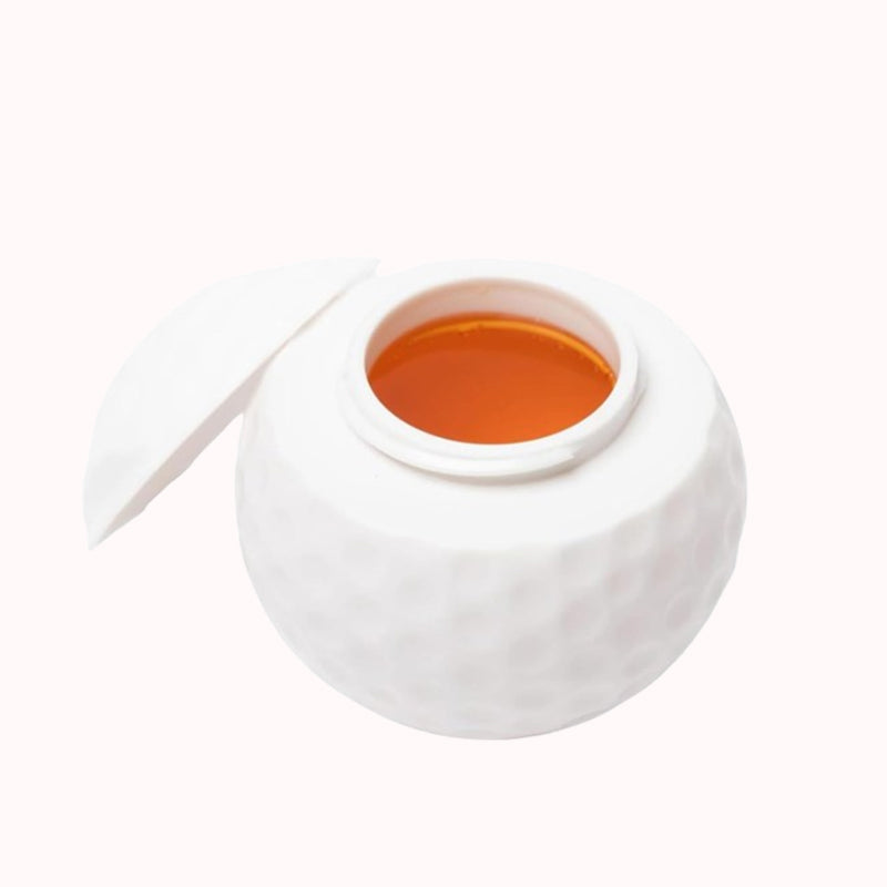 Kreativt shotglas format som en golfboll